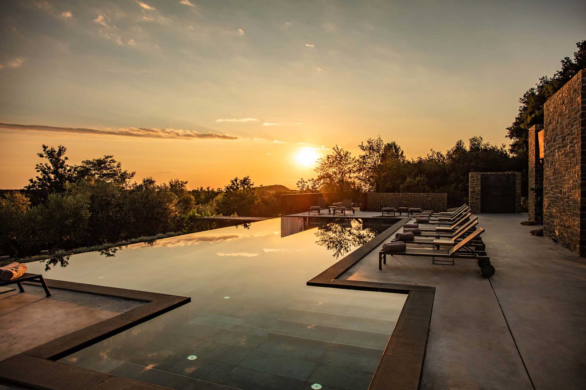 infinity pool and sunset